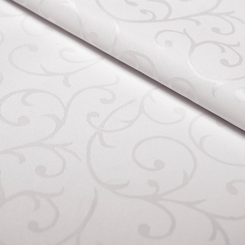 Obrusowa tkanina typu żakardowego w kolorze białym.