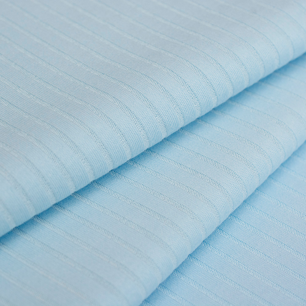 Dzianina RIB to bawełniana dzianina o charakterystycznej fakturze wąskiego prążka, wykonana z naturalnych włókien.