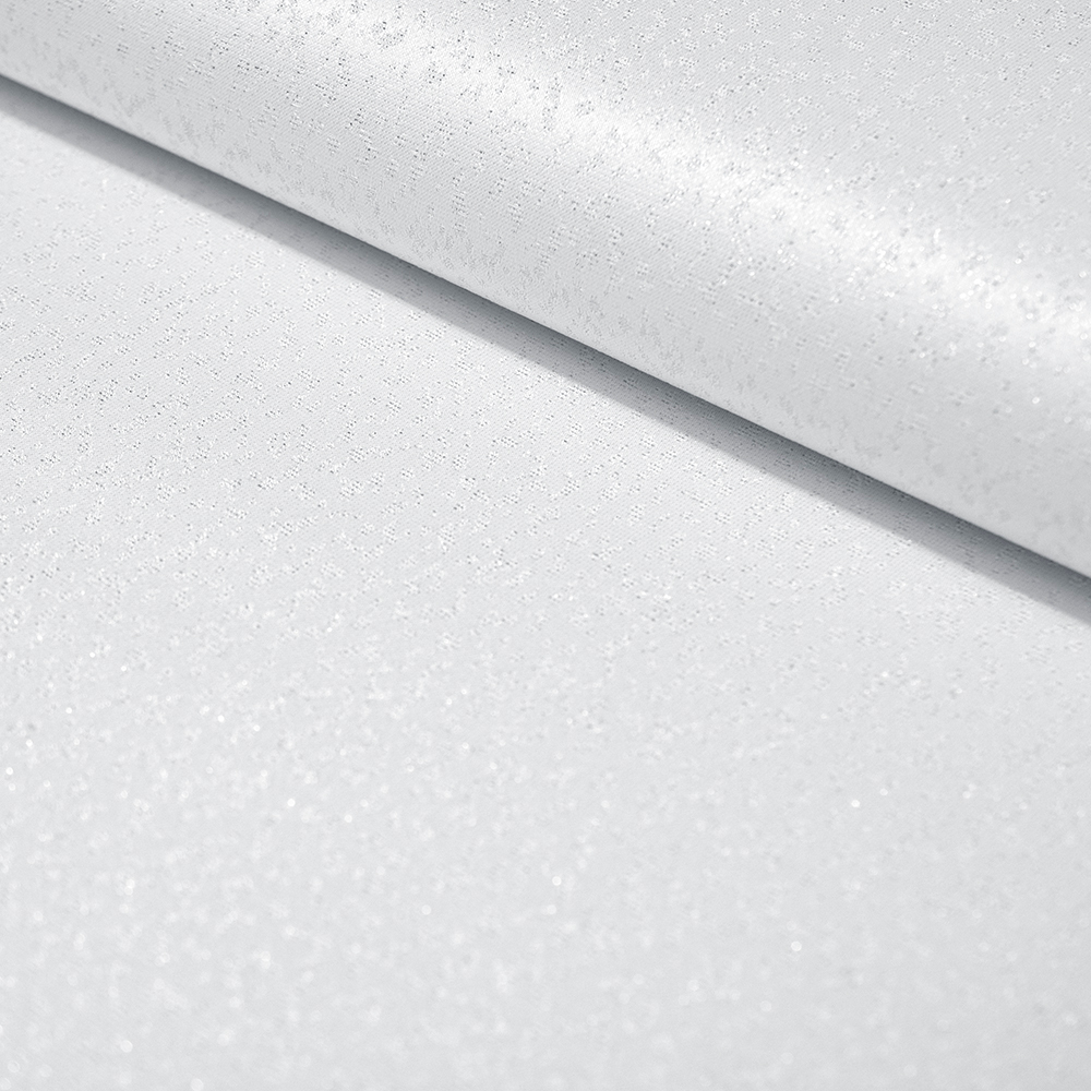 Tkanina obrusowa typie żakardowym, ozdobiona srebrnym wzorem w cętki.