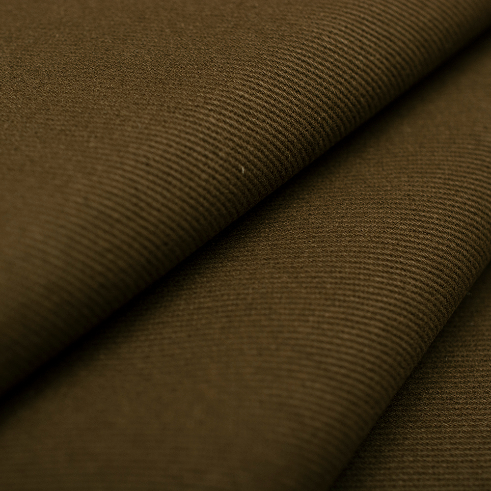 Jeansowa tkanina bawełniana wyróżnia się diagonalną fakturą i jednolitym kolorem.