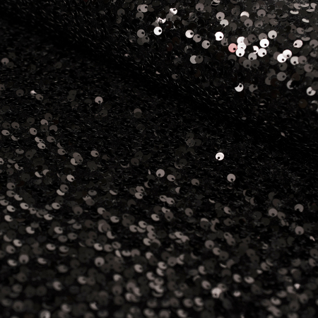 Efektowna dzianina welurowa ozdobiona nieregularnie rozmieszczonymi cekinami zachwyca oryginalnym wyglądem i wyjątkowym blaskiem.