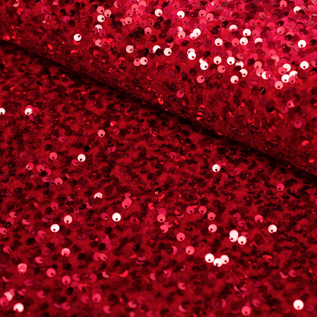 Efektowna dzianina welurowa ozdobiona nieregularnie rozmieszczonymi cekinami zachwyca oryginalnym wyglądem i wyjątkowym blaskiem.