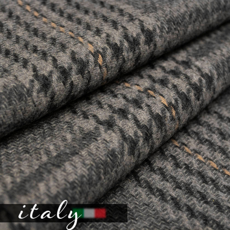 Elegancka tkanina płaszczowa wykonana z wysokiej jakości wełny to doskonały wybór na sezon jesienno-zimowy.