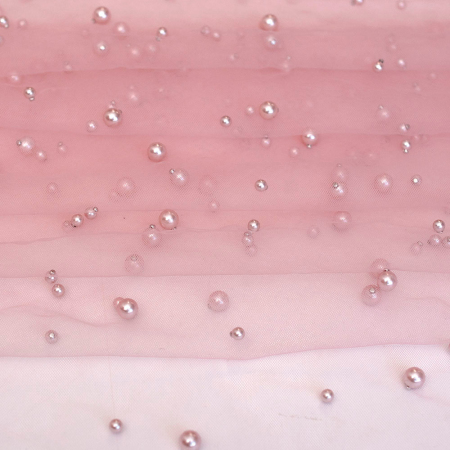 Tiul perełka, delikatna tkanina w formie siateczki.