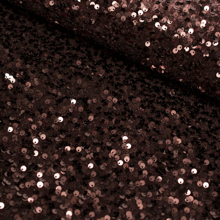 Efektowna dzianina welurowa ozdobiona nieregularnie rozmieszczonymi cekinami zachwyca oryginalnym wyglądem i wyjątkowym blaskiem.