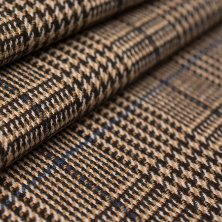 Elegancka tkanina wełniana o wysokiej jakości, wykonana z połączenia włókien naturalnych i syntetycznych.