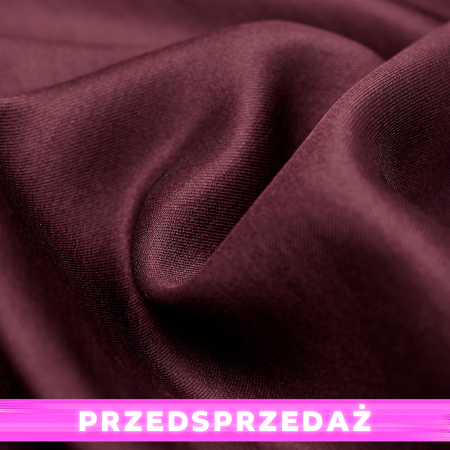 Elegancka tkanina wykonana z włókien satynowych, wyróżniająca się subtelnym połyskiem oraz charakterystyczną strukturą splotu.